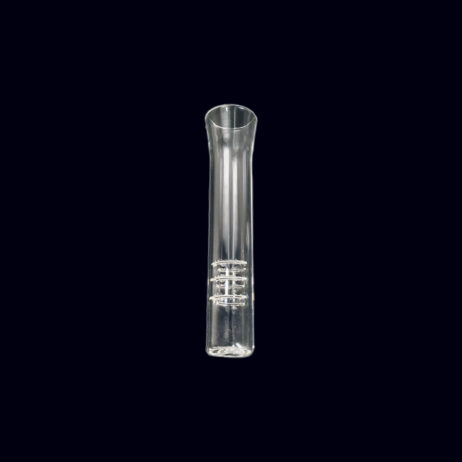 A clear tube of liquid is sitting on the ground.