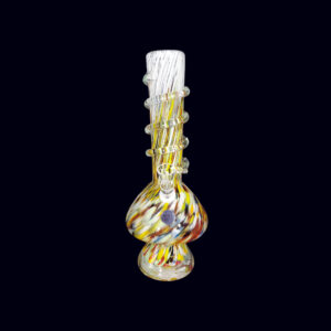 A glass pipe with a yellow and red design.